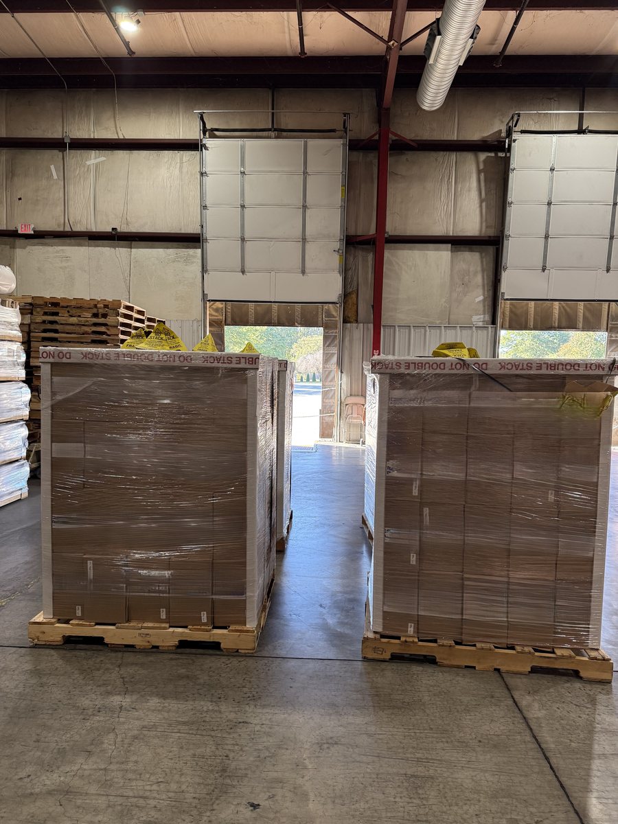 Wrapped pallets staged in the DGL Logistics warehouse ready for shipment